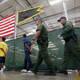 Young detainees escorted to an area to make phone calls.
